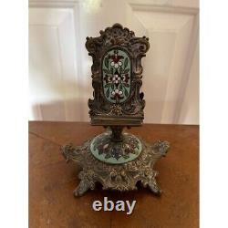 Antique matchbox stand with enamelled panelling